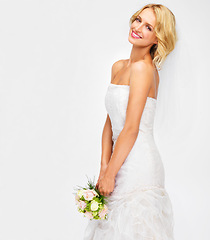 Image showing Portrait of bride wedding with flower bouquet and marriage dress on studio white background. Happy, smile and beauty of elegant young woman in bridal fashion getting married for celebration event