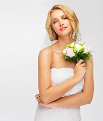 Image showing Marriage, wedding and woman or bride in a studio with a bouquet on a white background. Portrait face of a young model with rose flowers, beauty makeup and wedding dress fashion design with mockup