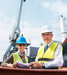 Image showing Ship engineer team planning in a meeting on the dock talking about paper work, cargo and shipping. Portrait of happy and smiling logistics managers working in the import and export industry