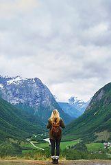 Image showing Travel adventure woman enjoying view of majestic glacial valley on exploration discover beautiful earth