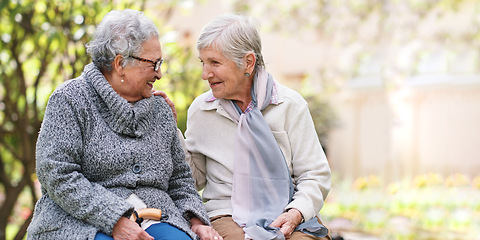 Image showing Two elderly women sitting on bench in park smiling happy life long friends enjoying retirement