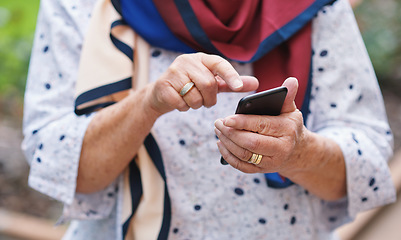 Image showing Old woman hands using smartphone texting sending messages on mobile phone outdoors