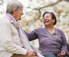 Image showing Elderly women sitting on bench in park smiling happy life long friends enjoying retirement