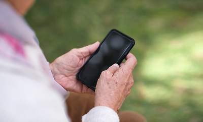 Image showing Old woman hands using smartphone texting sending messages on mobile phone outdoors