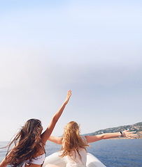 Image showing Beautiful girl friends arms raised travel on speed boat to paradise island for relaxing nature tourist destination vacation discover explore