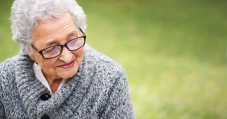 Image showing Portrait elderly woman sitting on bench in park smiling looking thoughtful enjoying retirement contemplating life