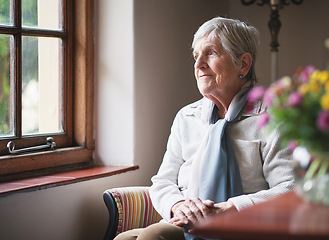 Image showing Happy elderly woman looking out window thinking of memories pensioner retirement lifestyle concept