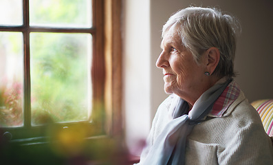 Image showing Happy elderly woman looking out window thinking of memories pensioner retirement lifestyle concept
