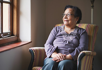 Image showing Happy elderly woman looking out window thinking of memories pensioner retirement lifestyle concept