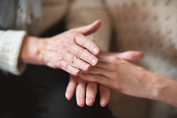 Image showing Elderly woman holding hands with daughter