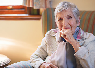 Image showing Portrait happy elderly woman smiling sitting on sofa at home enjoying retirement