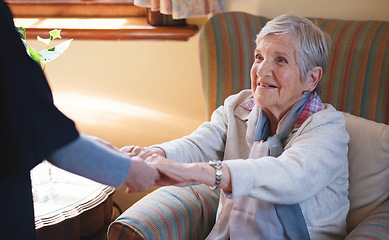 Image showing Nurse helping old woman holding hands in retirement home