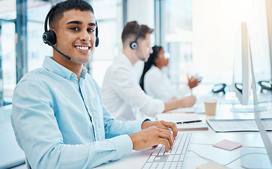 Image showing Sales man, call center agent and customer service support operator giving advice, help and expert communication while working in office. Portrait of young consultant, crm telemarketing and contact us