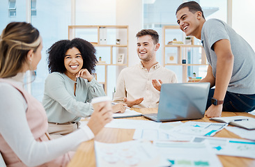 Image showing Happy business people laughing and enjoying a casual chat in an office, taking a break from paperwork. Diverse work friends bonding and talking about a funny story, smiling, listening and chilling
