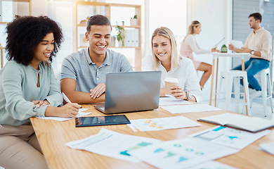 Image showing Happy business people working on a laptop in a corporate office, reading goals and strategy. Diverse coworkers collaborating on a digital online project, discussing and positive problem solving