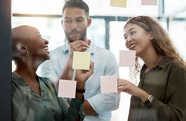 Image showing Happy team collaboration and planning with sticky notes in an office of an advertising and marketing startup. Diversity, teamwork and business strategy in a creative staff business meeting at work