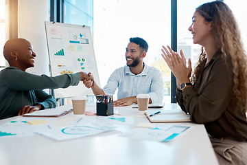 Image showing Handshake, deal and teamwork with a team in collaboration on a partnership in a meeting for planning and strategy. Applause, vision and mission of a startup company for growth and development