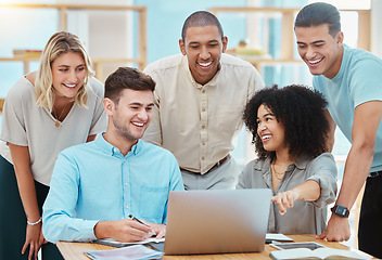 Image showing Happy business people watching a laptop in an office, laughing and bonding during a conference call. Diverse team discussing strategy while looking at an online presentation together, sharing ideas