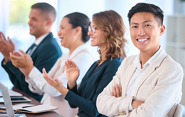 Image showing Teamwork, motivation and celebration with clapping business people cheering during speech or presentation. Portrait of a happy employee enjoying his career while sitting with diverse team in training