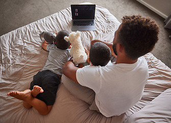 Image showing Technology, man and children relax on bed together to bond and have fun on the weekend. Happy father having quality time with his kids at family home for positive and healthy relationship.