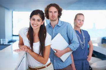 Image showing Creative business people, team and office of proud, happy and successful coworkers standing in the workplace. Portrait of a young group of designers in corporate work in teamwork success with smile.