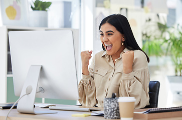 Image showing Business woman, happy and excited at her office computer, celebration of great news in email. Financial freedom, a deal and corporate success for startup employee after first sale on company website.