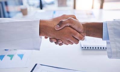 Image showing Handshake, collaboration and documents of hands in agreement, teamwork and meeting for project plan at the office. People in partnership for team, planning and strategy for analytics at a workplace.