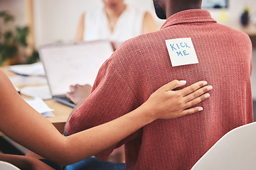 Image showing Office prank, comic and work bullying of a corporate team placing a kick me sticky note. Working, collaboration and business teamwork playing a april fool funny, comedy and joke on a employee