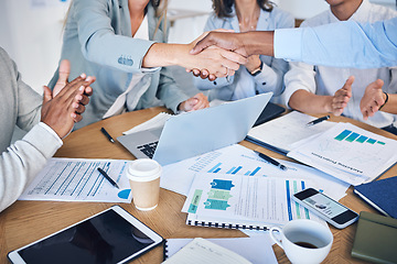 Image showing Business people giving handshake for success and support in finance meeting with report, teamwork collaboration and giving welcome to startup accounting company. Thank you in seminar and agreement