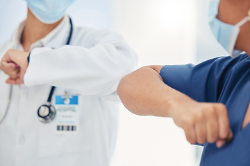 Image showing Covid handshake of a nurse and doctor as a surgery success, welcome or support gesture. Medical and healthcare workers working in a hospital, wellness clinic of doctors office greeting at work