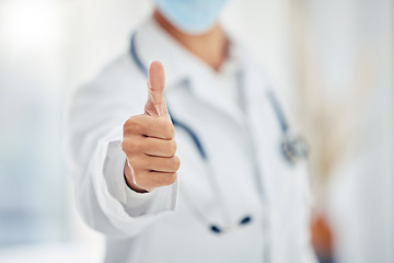 Image showing Medical doctors hand show thumbs up for success or goal working at a hospital. Giving support, motivation and good service in an office at clinic. Healthcare worker showing winning sign or emoji