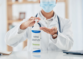 Image showing Covid, hand sanitizer and hygiene with doctor, pharmacist or medical healthcare professional with a face mask. Health, insurance and consulting in hospital, clinic or office with expert behind desk