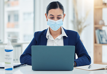 Image showing Face mask, covid and business woman with laptop in safety, security and strategy to stop global virus in office. Employee and compliance worker against bacteria spread at company desk with technology
