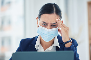 Image showing Headache pain from covid, tired and burnout business woman working on laptop with mask, stress about work problem and mistake. Manager, employee and worker with migraine, thinking and frustrated