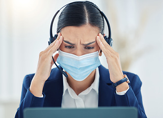 Image showing Burnout, headache and pain call center agent working on laptop, headset and medical face mask. Tired, stress and frustrated customer service or contact us woman working on computer with 404 error