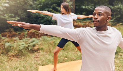 Image showing Couple, nature and yoga of a man and woman in workout exercise for the mind, body and spirit outdoors. Interracial fitness people together in relaxing exercises, stretching and balance lifestyle.