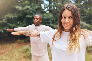 Image showing Fitness, zen and yoga couple exercise outdoors in park or forest together, bonding while living a healthy lifestyle. Interracial girlfriend and boyfriend training balance and posture while meditating