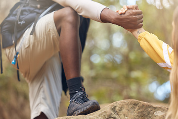 Image showing Hands of support and help for hiking couple walking, travel or trekking on rock in countryside nature forest. Earth trees, freedom and teamwork adventure for camping, love and diversity man and woman