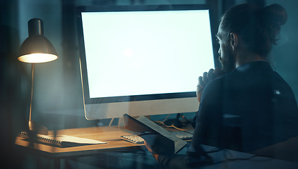 Image showing Business man doing web design on computer at work, designer planning website online and working on advertising strategy in a dark office at night. Programmer doing overtime and programming on screen
