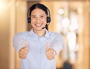 Image showing Thumbs up for success, success at call center company and hand sign for achievement in telemarketing industry at work. Portrait of a customer support worker helping, in agreement and support in sales