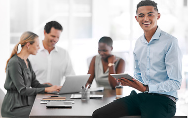 Image showing Portrait of a happy businessman smile with a tablet in a team planning meeting at work. An employee in an office with his team as they discuss strategy or plans, and strategies in a corporate office