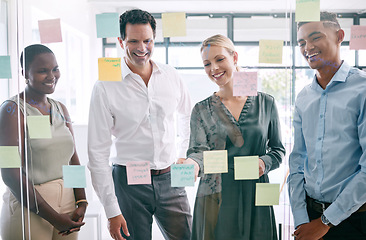 Image showing Planning, sticky notes and diversity marketing business people working in partnership, collaboration and strategy meeting. Thinking, innovation and team work on glass wall for media advertising idea