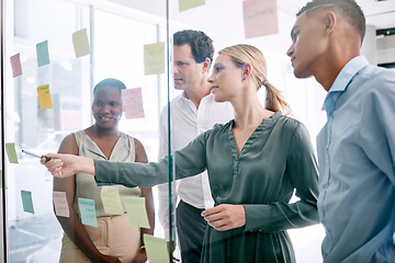 Image showing Vision, innovation and thinking with business people planning on sticky notes in an office. Creative teamwork collaboration on a goal and target while discussing a mission, design or target together