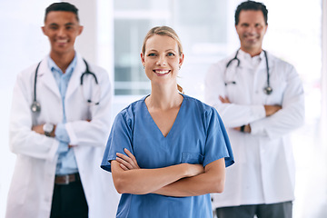 Image showing Portrait of medical doctors with crossed arms with a stethoscope standing in the hospital hallway. Happy healthcare workers after clinic trial, surgery or consultation success at a medicare center.