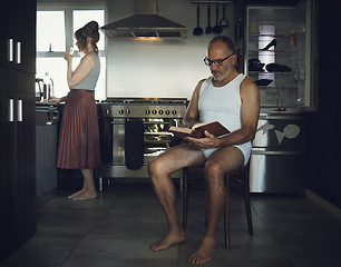 Image showing Marriage, problem and mental health issue with bored old couple in toxic, dark or sad family home kitchen together. Divorce, alcoholic and depression married relationship with broken household