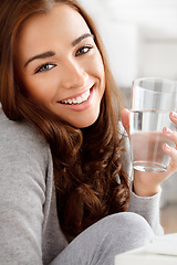 Image showing Wellness, hydration and water with young woman living a balance diet lifestyle, drinking refreshing drink at home. Portrait of thirsty female on natural cleanse, enjoying health and mineral benefits