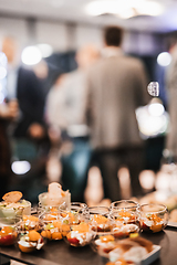 Image showing Blurred image of businesspeople at banquet business meeting event. Business and entrepreneurship events concept. Focused on the canapes.