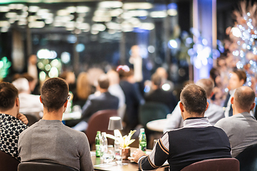 Image showing Rear view of unrecognizable people at banquet business meeting event. Business and entrepreneurship events concept