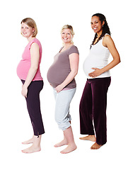 Image showing Pregnant women, friends and happy mothers or people celebrating motherhood on studio background. Portrait, health and pregnancy with a smile ready or hope for child birth, kids or children or baby.