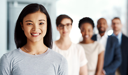 Image showing Happy business woman with team, looking confident and standing with employees at a startup company. Portrait of a manager, boss or female expressing leadership, teamwork and support with coworkers
